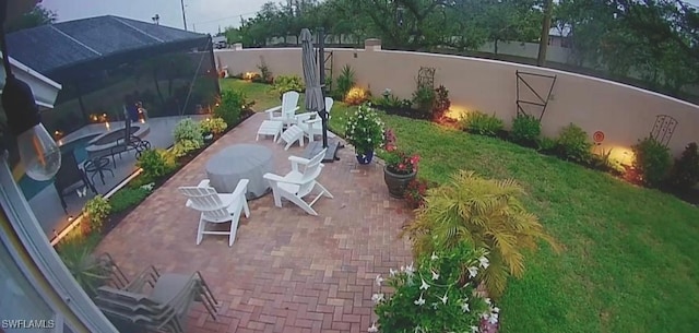 view of patio / terrace with a lanai