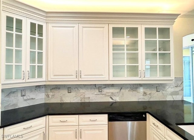 kitchen featuring white cabinets, decorative backsplash, and dishwasher