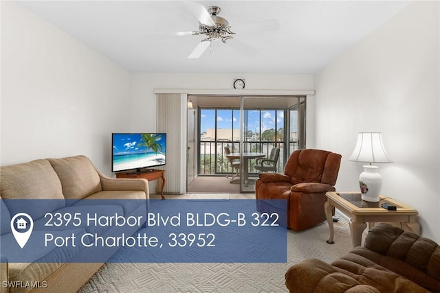 carpeted living room featuring ceiling fan