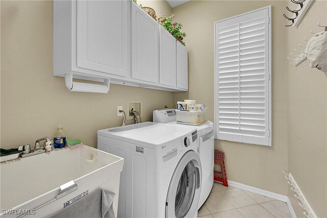 9209 Garden Pointe, Fort Myers, FL 33908 - laundry room with sink, light tile patterned floors, washer and clothes dryer, and cabinets