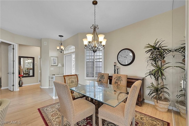 9209 Garden Pointe, Fort Myers, FL 33908 - dining space featuring an inviting chandelier and light hardwood / wood-style floors