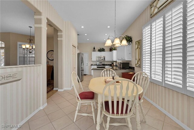 9209 Garden Pointe, Fort Myers, FL 33908 - dining area with an inviting chandelier and light tile patterned flooring