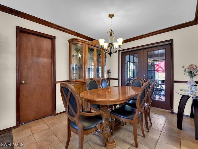 tiled dining space featuring french doors, crown molding, and an inviting chandelier