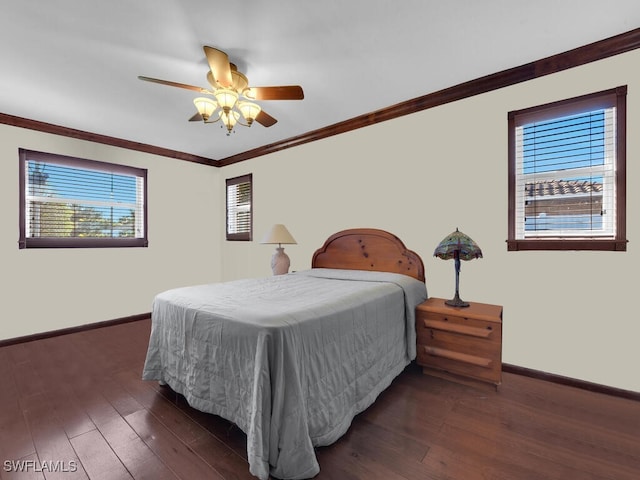 bedroom with ceiling fan, dark hardwood / wood-style flooring, and crown molding