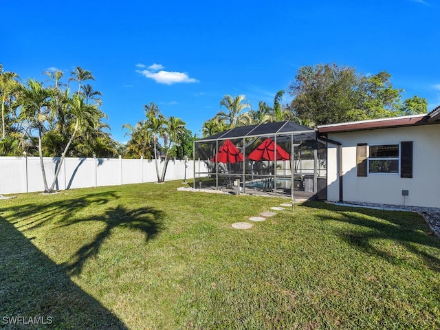 view of yard with a lanai