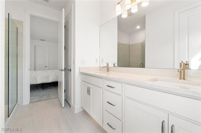 bathroom with vanity and a shower with shower door