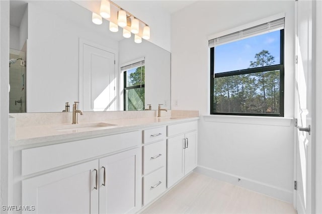 bathroom with vanity and an enclosed shower