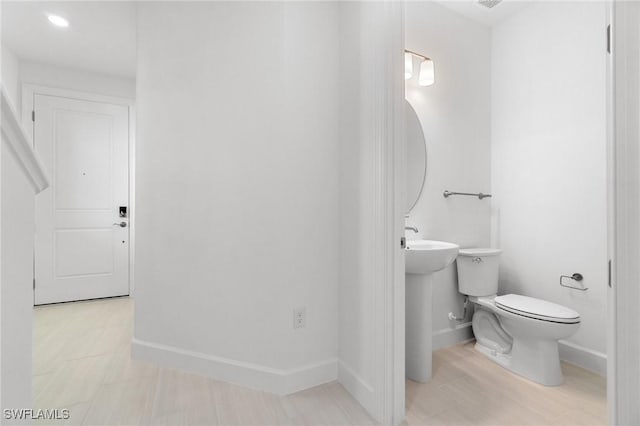 bathroom with sink and toilet