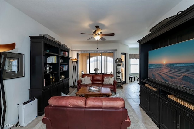 tiled living room featuring ceiling fan