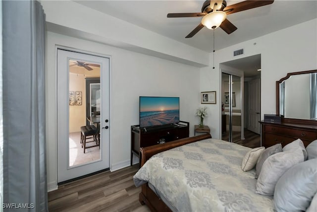 bedroom featuring a closet, ceiling fan, and dark hardwood / wood-style flooring