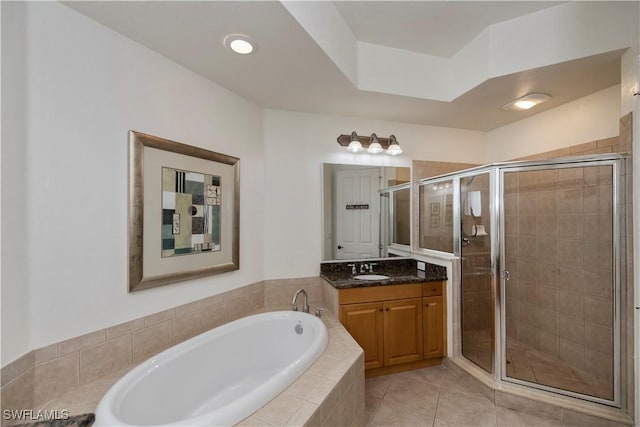 bathroom featuring separate shower and tub, tile patterned flooring, and vanity