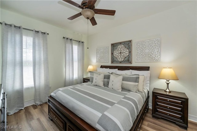 bedroom featuring ceiling fan and hardwood / wood-style flooring