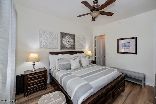 bedroom with ceiling fan and hardwood / wood-style floors