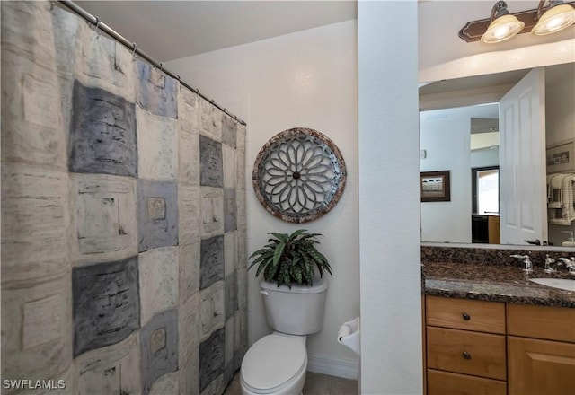 bathroom featuring vanity, toilet, and walk in shower