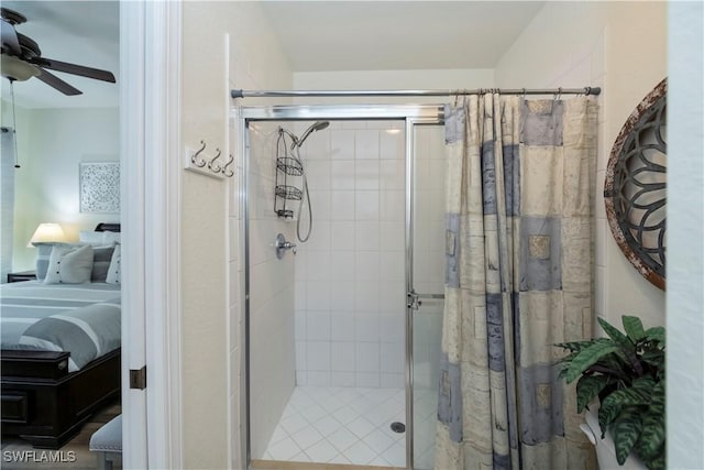 bathroom featuring walk in shower and ceiling fan