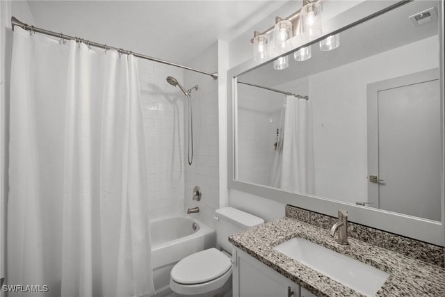 full bathroom with shower / tub combo, vanity, and toilet