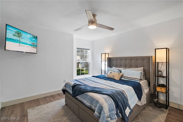 bedroom featuring hardwood / wood-style floors and ceiling fan