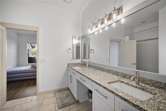 bathroom with tile patterned flooring and vanity