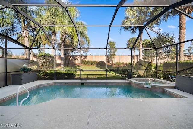 view of swimming pool with glass enclosure and an in ground hot tub