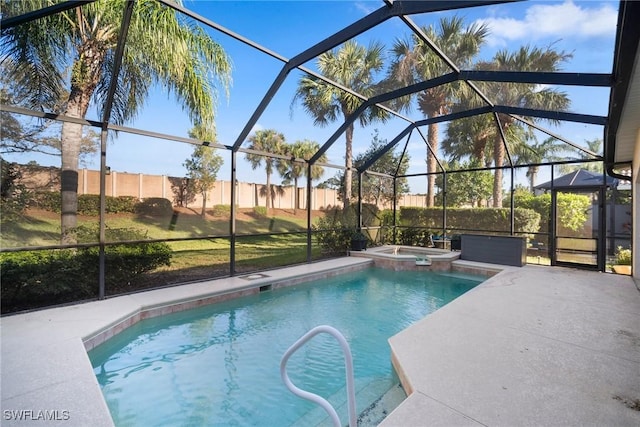 view of swimming pool featuring an in ground hot tub, a patio, and a lanai