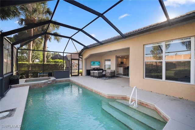 view of pool with glass enclosure, a patio area, and an in ground hot tub