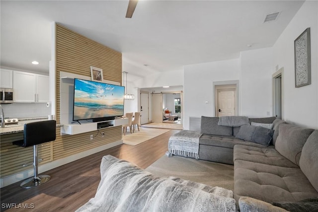 living room with dark hardwood / wood-style flooring