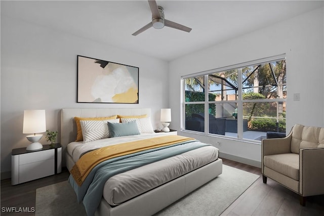 bedroom featuring ceiling fan and dark wood-type flooring