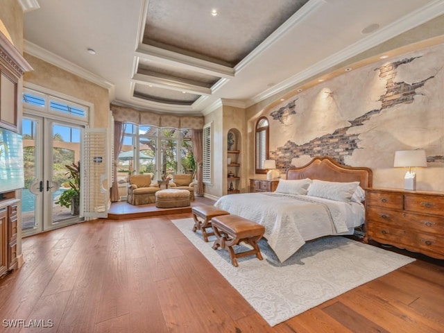 bedroom with access to outside, french doors, coffered ceiling, and ornamental molding