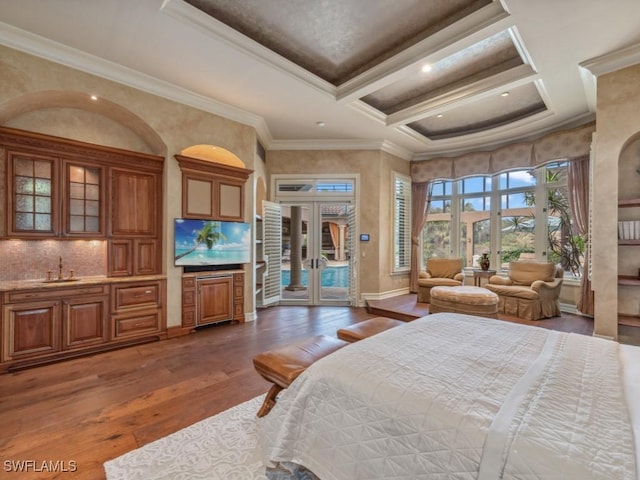 bedroom featuring coffered ceiling, french doors, sink, dark hardwood / wood-style floors, and ornamental molding