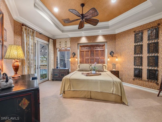 carpeted bedroom with access to outside, a raised ceiling, ceiling fan, and crown molding