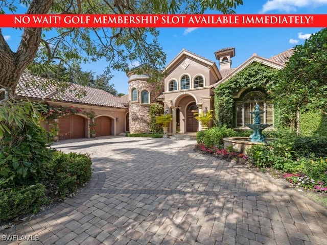 view of front of property with a garage