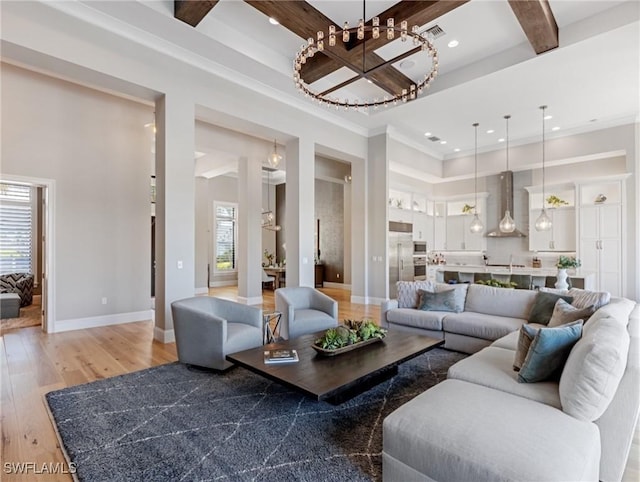 living room with a high ceiling, ornamental molding, beamed ceiling, and hardwood / wood-style floors