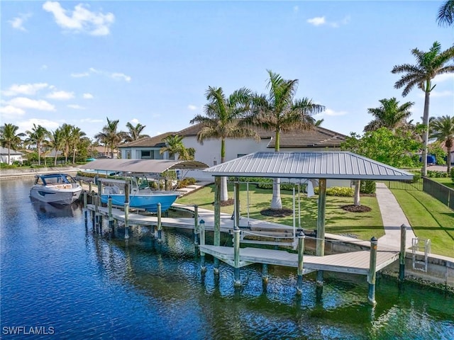 dock area featuring a yard and a water view