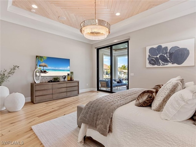 bedroom featuring a raised ceiling, access to outside, and wood ceiling