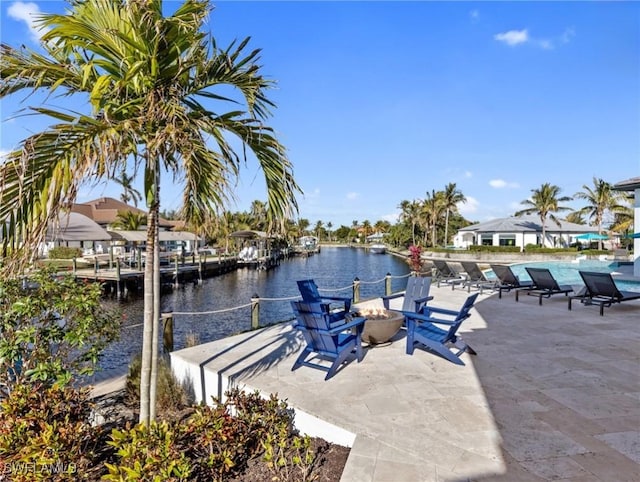 dock area with a water view and a patio area