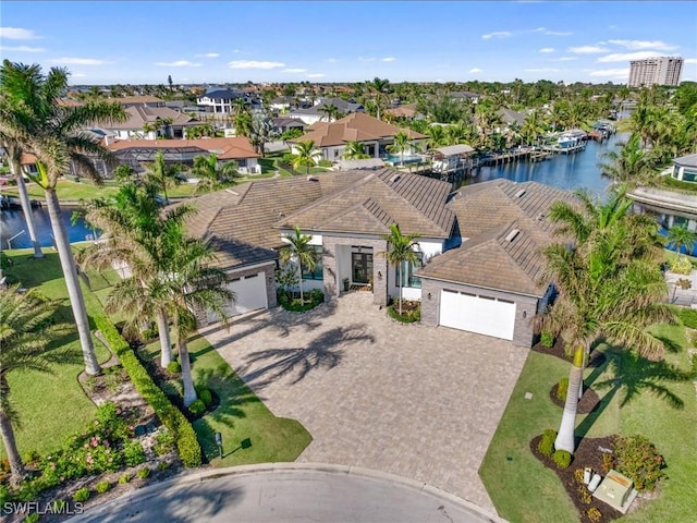 birds eye view of property featuring a water view