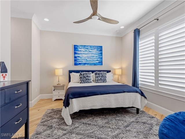 bedroom with ceiling fan and light hardwood / wood-style flooring