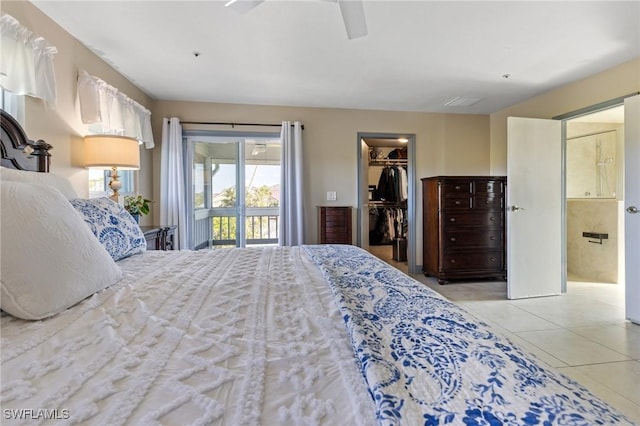 bedroom featuring ceiling fan, access to outside, light tile patterned flooring, a spacious closet, and a closet