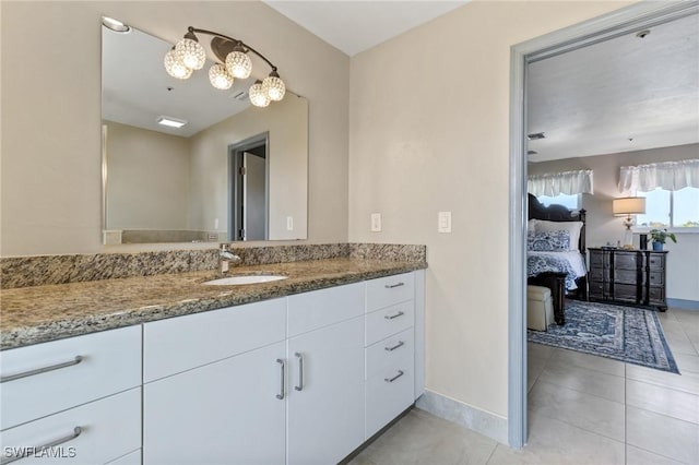 bathroom featuring tile patterned flooring and vanity