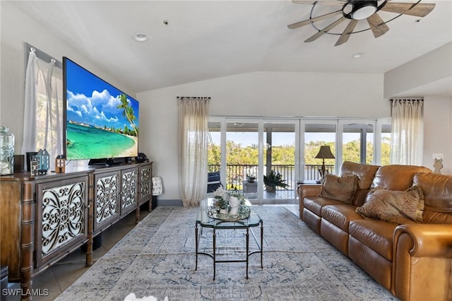 tiled living room featuring vaulted ceiling and ceiling fan