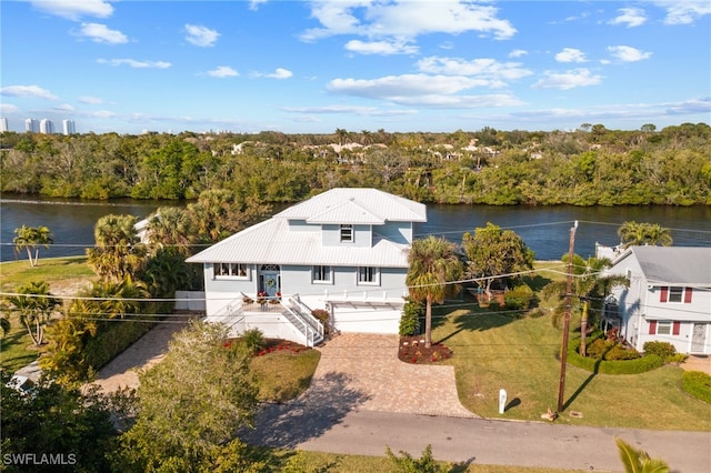 birds eye view of property featuring a water view