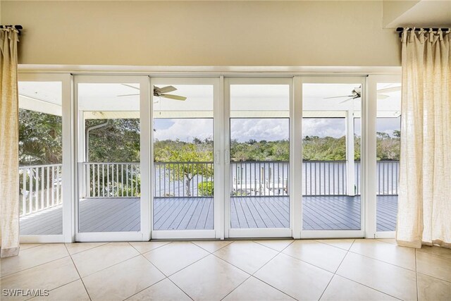 3968 Aloha Ln, Bonita Springs, FL 34134 - entryway with ceiling fan, a water view, tile patterned floors, and a sunroom