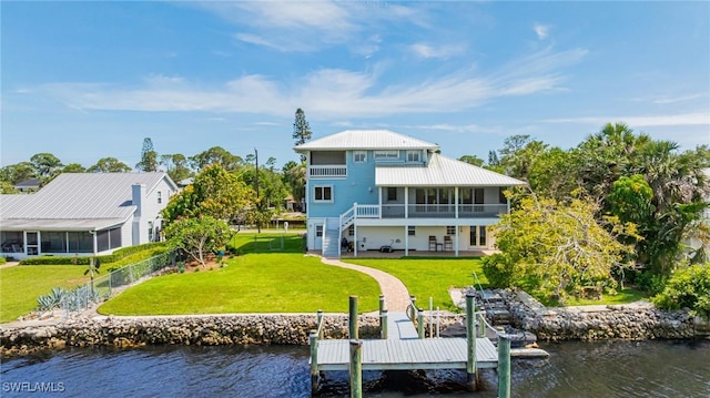 3968 Aloha Ln, Bonita Springs, FL 34134 - back of house featuring a sunroom, a water view, a patio, and stairs