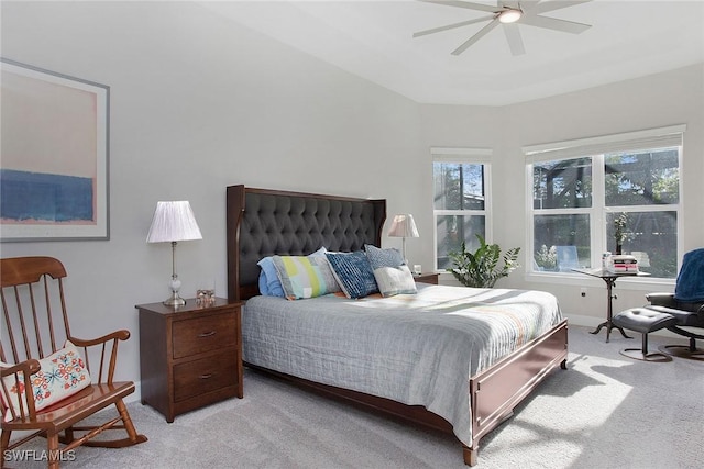 bedroom with light carpet and a ceiling fan