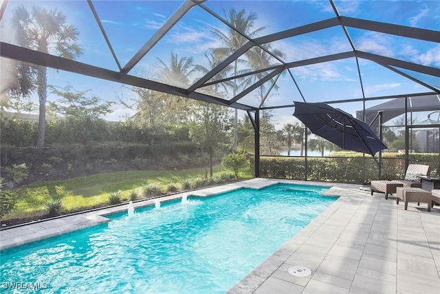 outdoor pool featuring a lanai and a patio area