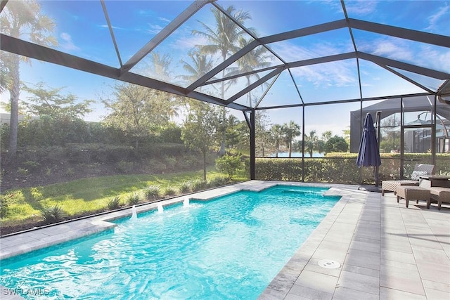 pool with glass enclosure and a patio