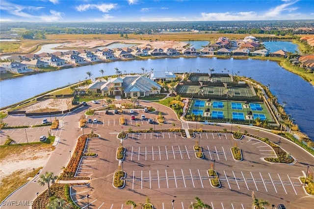 drone / aerial view with a residential view and a water view