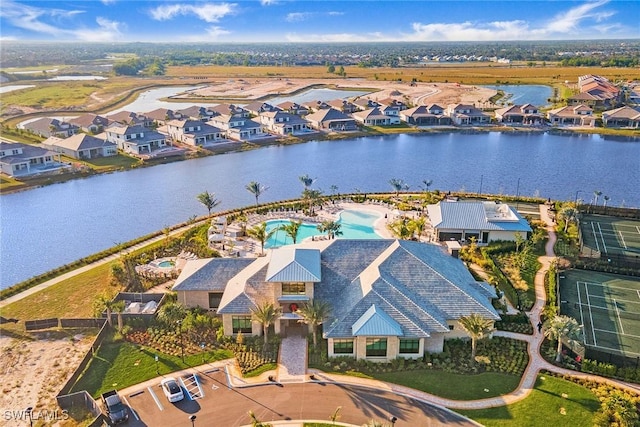 drone / aerial view featuring a residential view and a water view