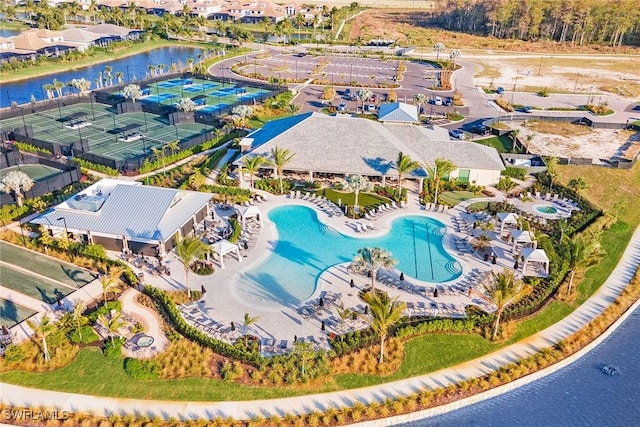 birds eye view of property featuring a water view