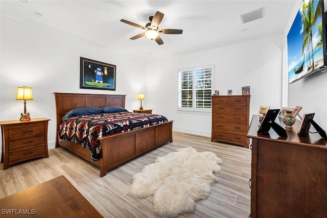 bedroom featuring ceiling fan, crown molding, and light wood-type flooring